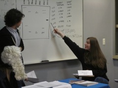 Callie points to the evidence on the board.